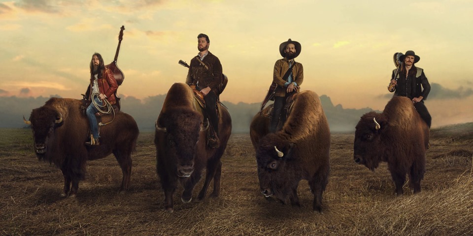 band of four men with instruments pictured on bison